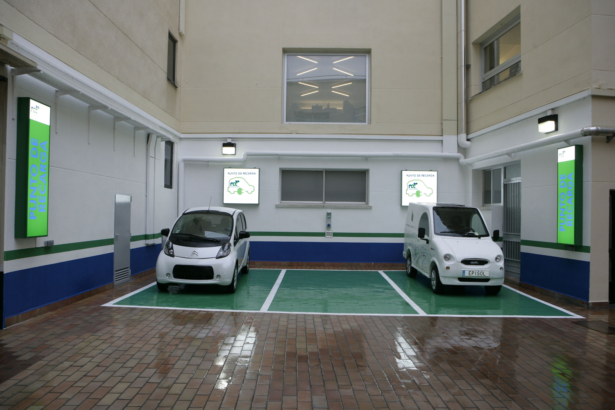 Parking spaces with electric car charging points.